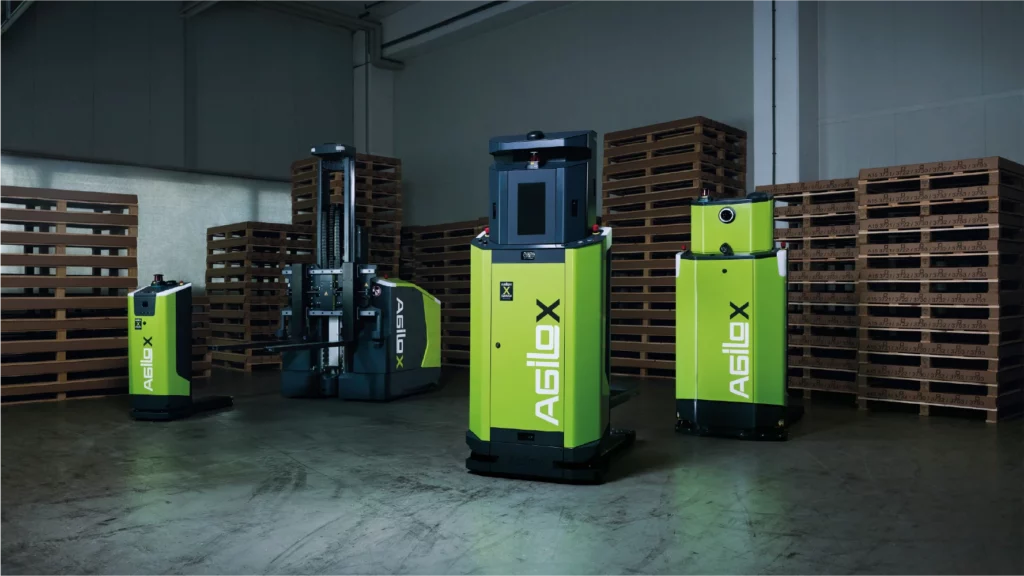 Autonomous mobile robots from Agilox operating in a warehouse environment